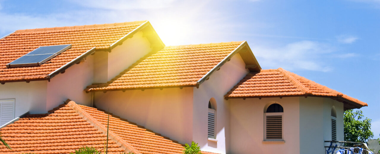 House-with-red-tile-roof-underneath-sunlight